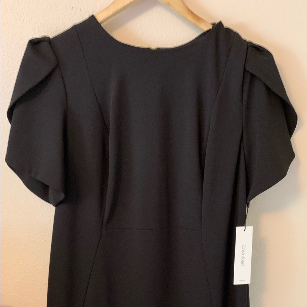 Brand new size  14W Calvin Klein Woman black stretch crepe dress. Sheath style.